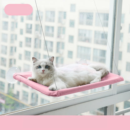 Roze raamhangmat met zuignappen met een kat die ontspannen aan het raam ligt