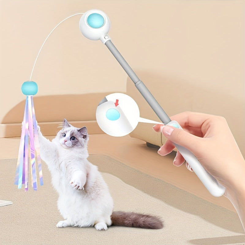 Kat grijpt naar de glitterkop van de blauwe uittrekbare kattenteaser